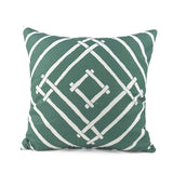 Island House outdoor pillow with green and white tropical pattern.