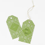 a gift tag with a geometric lattice pattern in green/yellow, with a space for personalized message.