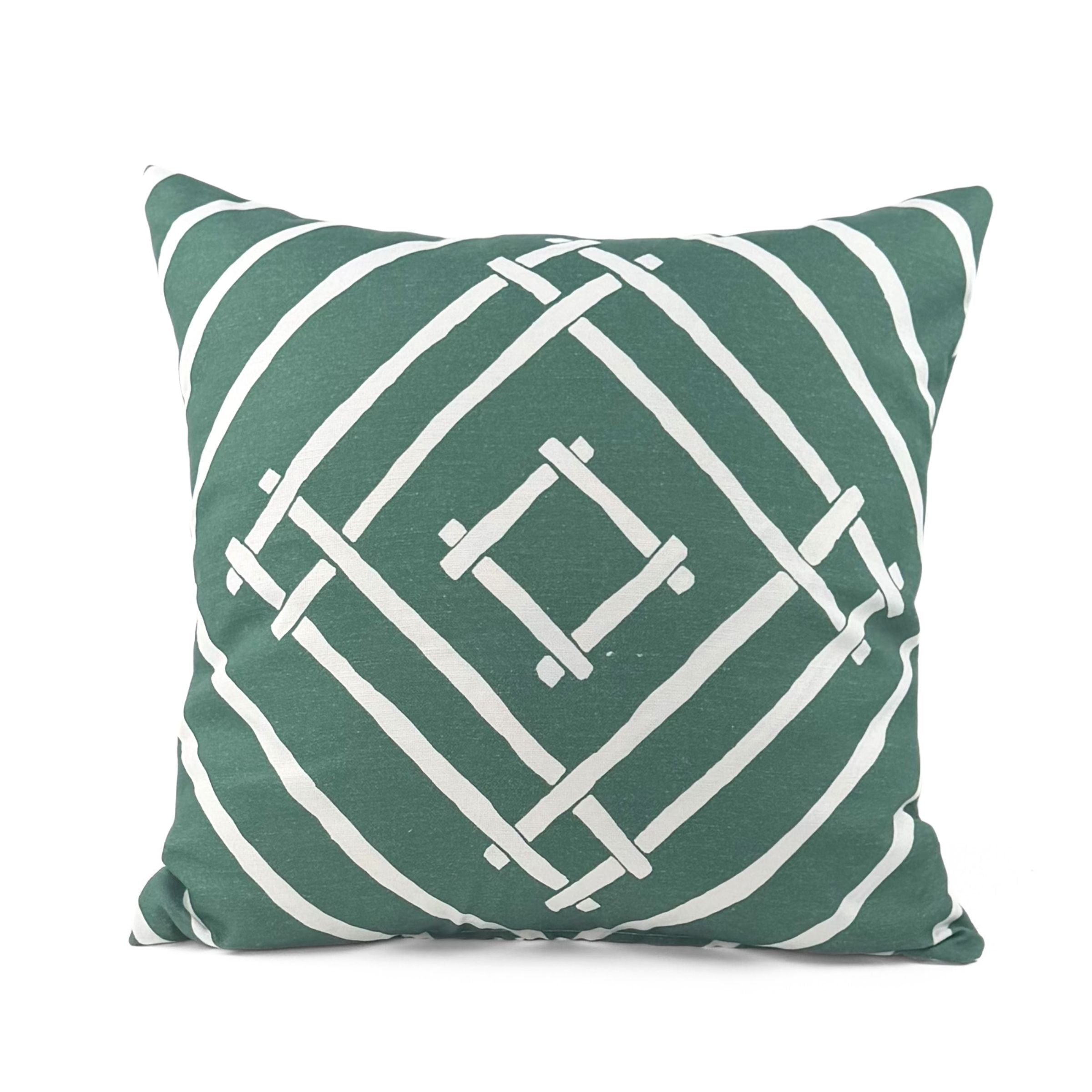 Island House outdoor pillow with green and white tropical pattern.