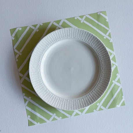White and green paper placemats featuring a white bamboo pattern called Island House by Madcap Cottage
