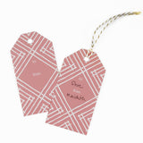 a gift tag with a geometric lattice pattern in pink, with a space for personalized message.