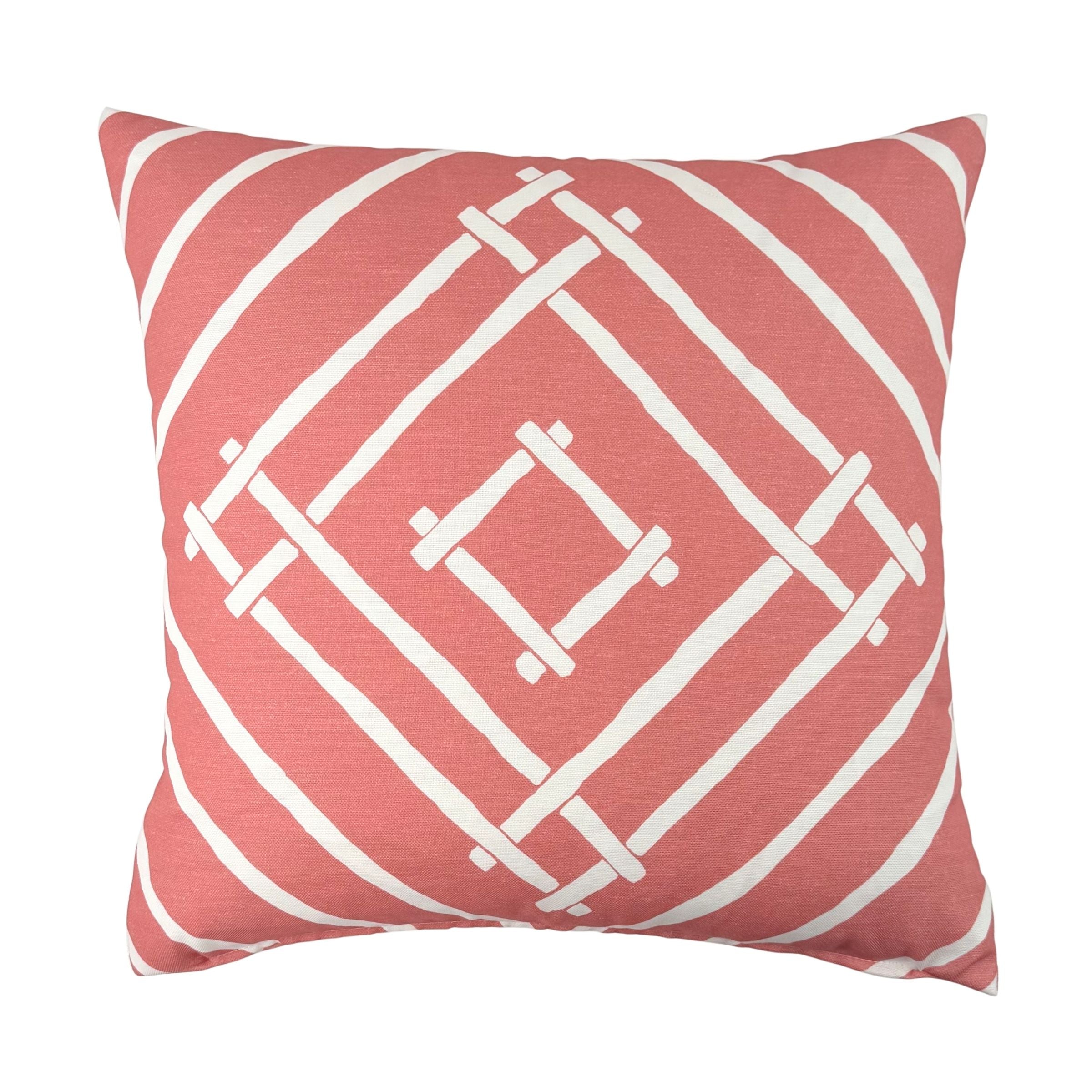 Island House outdoor pillow with pink and white tropical pattern.