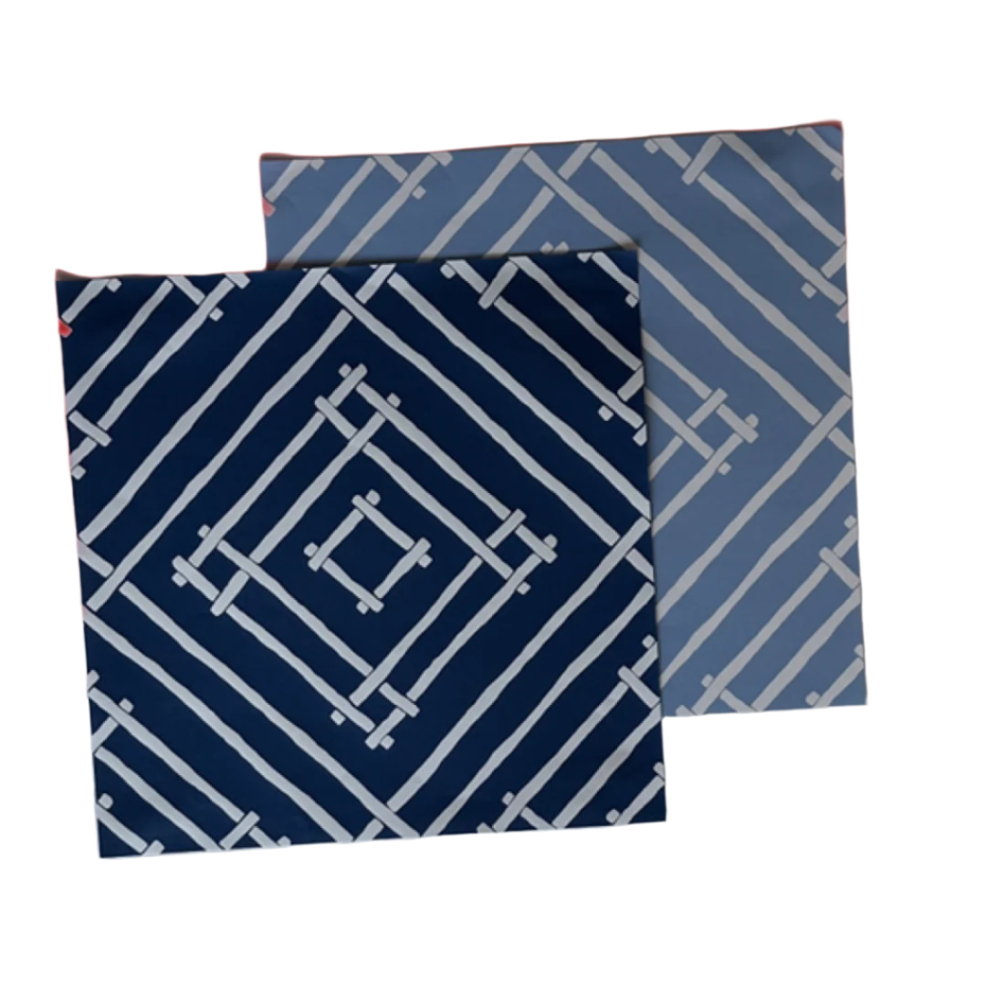 two square blue paper placemats with a white bamboo trellis design called "Island House" from Madcap Cottage.