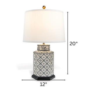 A small blue and white table lamp with a white lampshade with arrows denoting dimensions 20" high x 12" wide