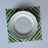 White and green paper placemats featuring a white bamboo pattern called Island House by Madcap Cottage