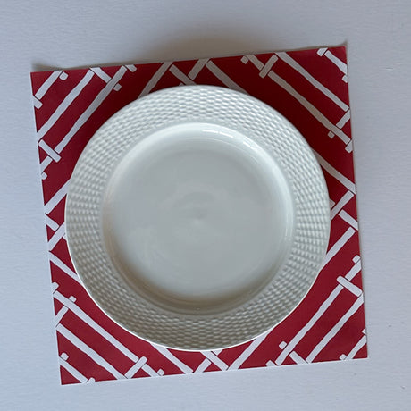 red paper placemats with a white bamboo design called island house by madcap cottage