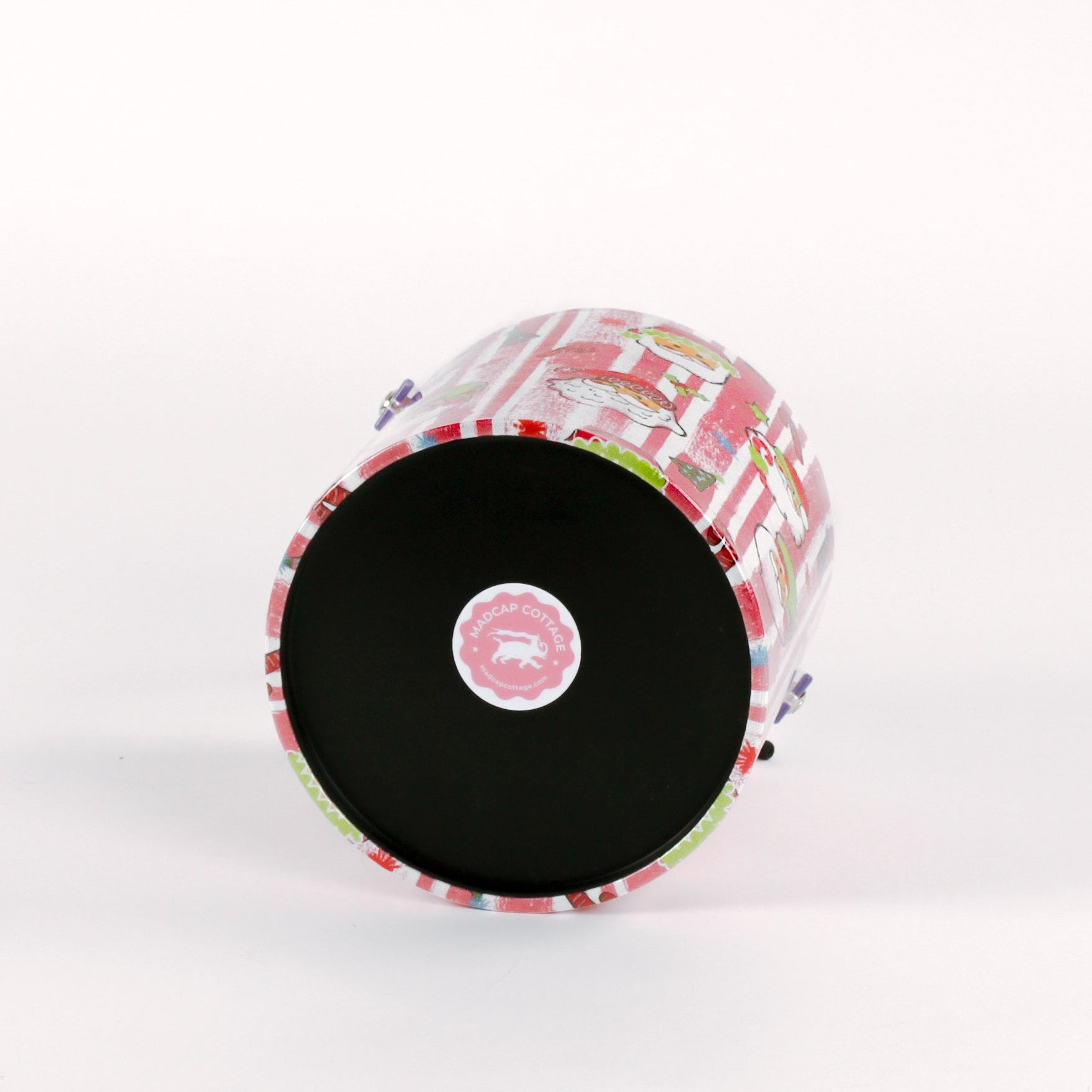 Jolly Santas is a pink and white stiped fabric with jolly santa motif on a 3 quart acrylic Christmas ice bucket showing it's bottom
