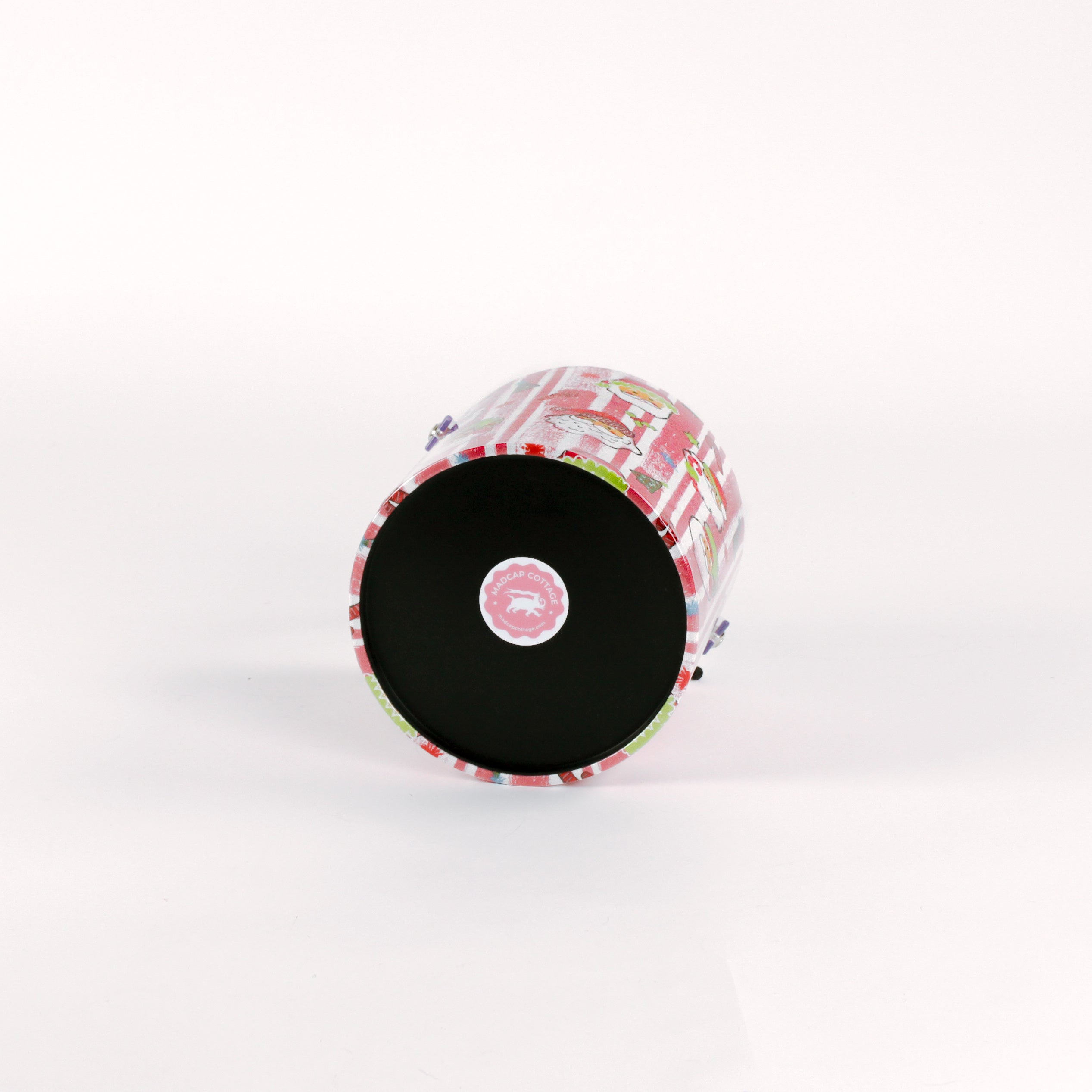 Jolly Santas is a pink and white stiped fabric with jolly santa motif on a 3 quart acrylic Christmas ice bucket showing it's bottom
