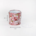 Jolly Santas is a pink and white stiped fabric with jolly santa motif on a 3 quart acrylic Christmas ice bucket with a dimension of 8" by 7.75"