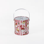 Jolly Santas is a pink and white stiped fabric with jolly santa motif on a 3 quart acrylic Christmas ice bucket