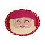 An oval Christmas rug featuring a large santa face