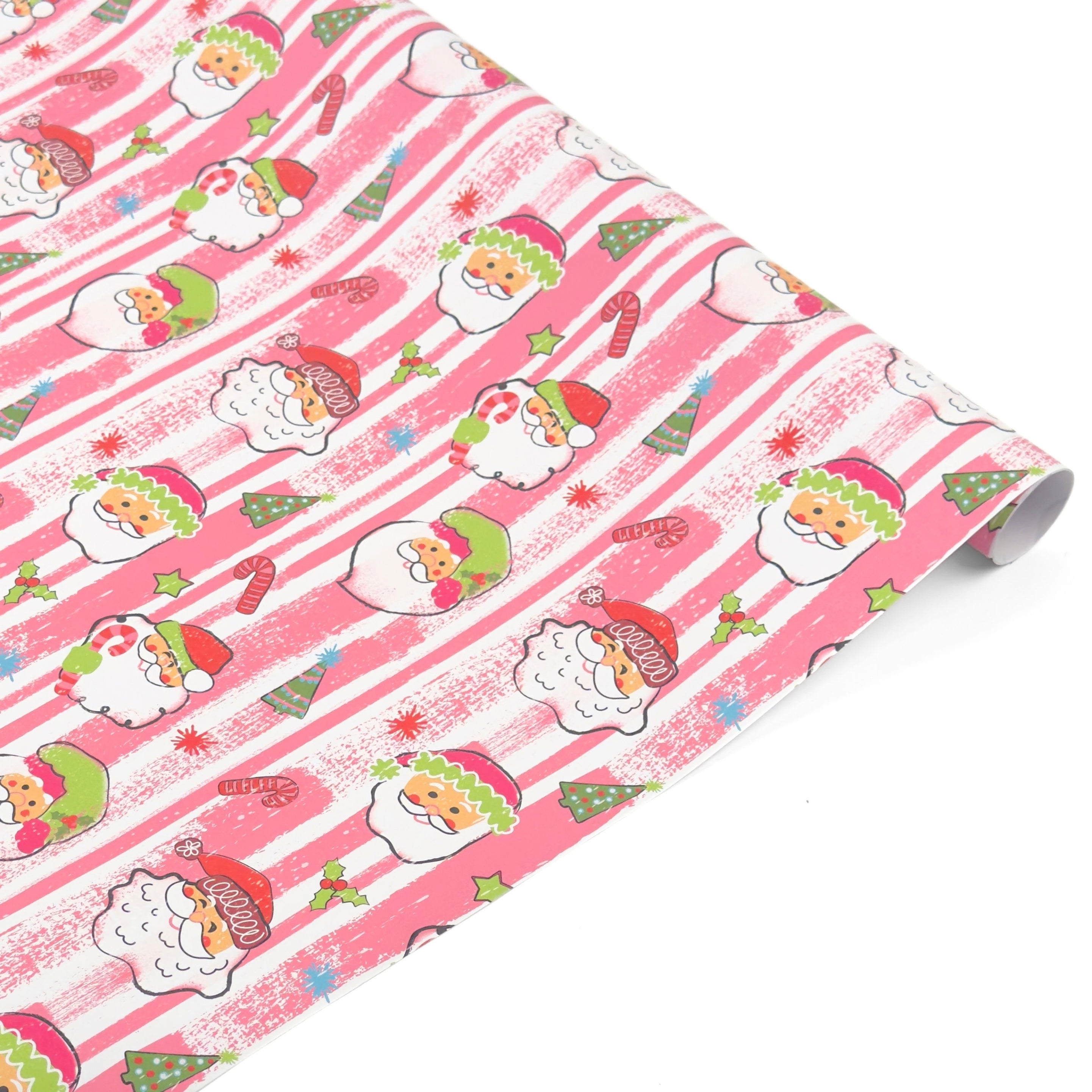 Festive Christmas gift wrap roll featuring cheerful Santa faces, pink stripes, candy canes, and trees.