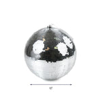 A large silver disco ball ornament measuring 10 inches wide, reflecting light with small mirror tiles, Christmas tea towel.