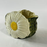 a large vintage daisy creamer with a large daisy forming the side of the pitcher. 