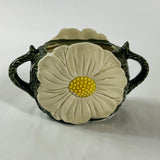 a large vintage daisy creamer with a large daisy forming the side of the pitcher. 