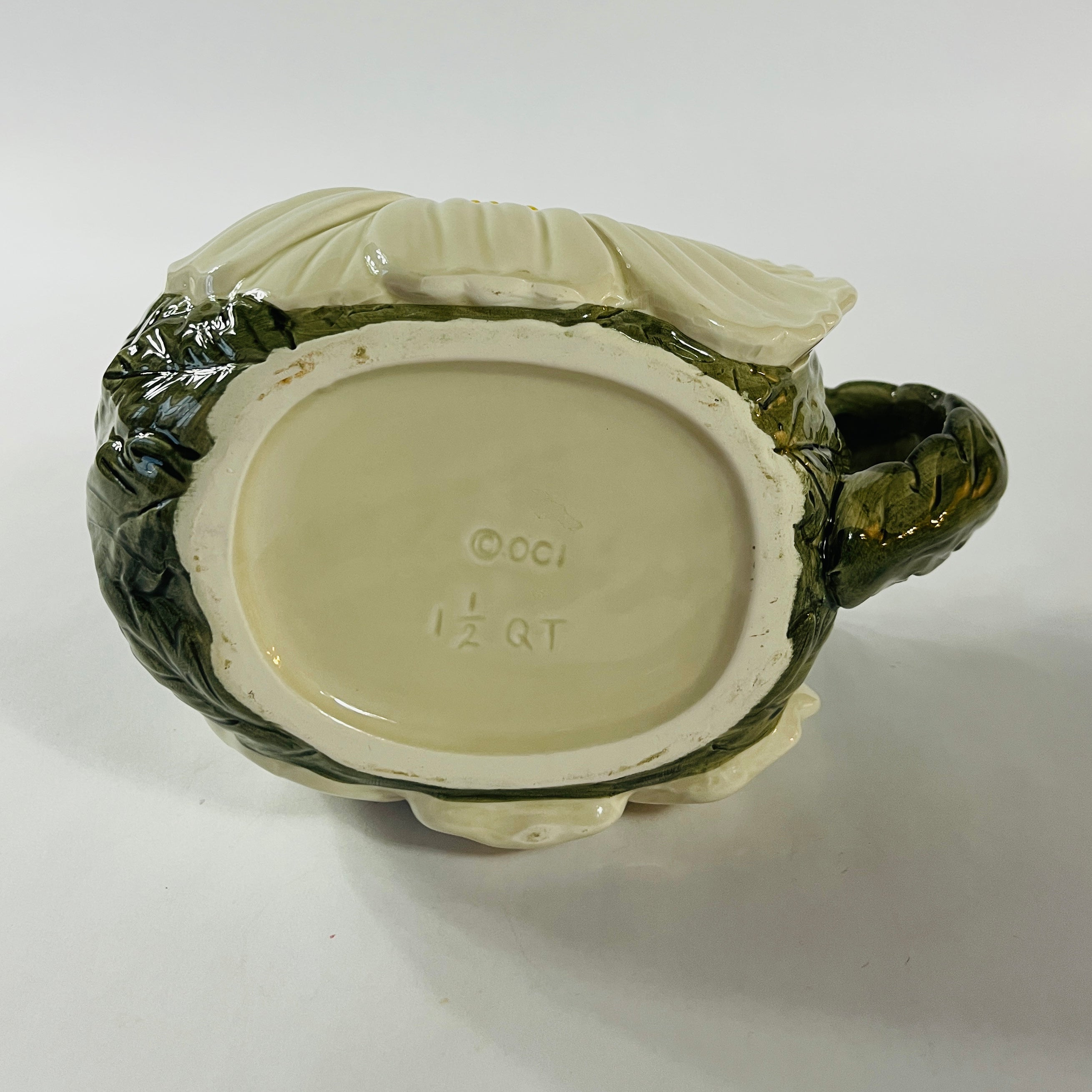 a large vintage daisy creamer with a large daisy forming the bottom of the pitcher. 