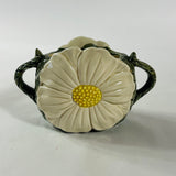 a large vintage daisy creamer with a large daisy forming the top of the pitcher. 