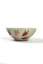 a large beige strawberry serving bowl decorated with pink and red strawberry motifs.