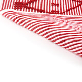 reverse of A red accent rug with a lattice pattern on it