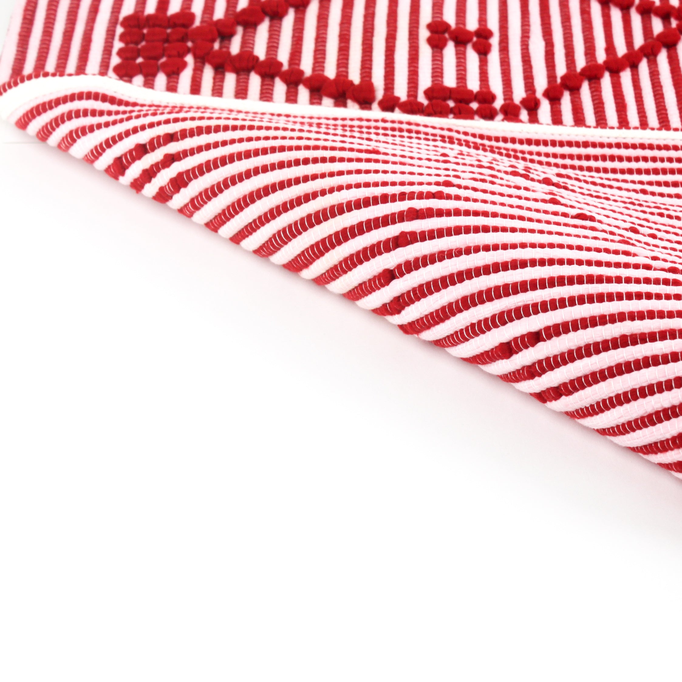 reverse of A red accent rug with a lattice pattern on it