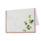 a white lemon tea towel with lemons in opposite corners and a red border resting against a white background. 