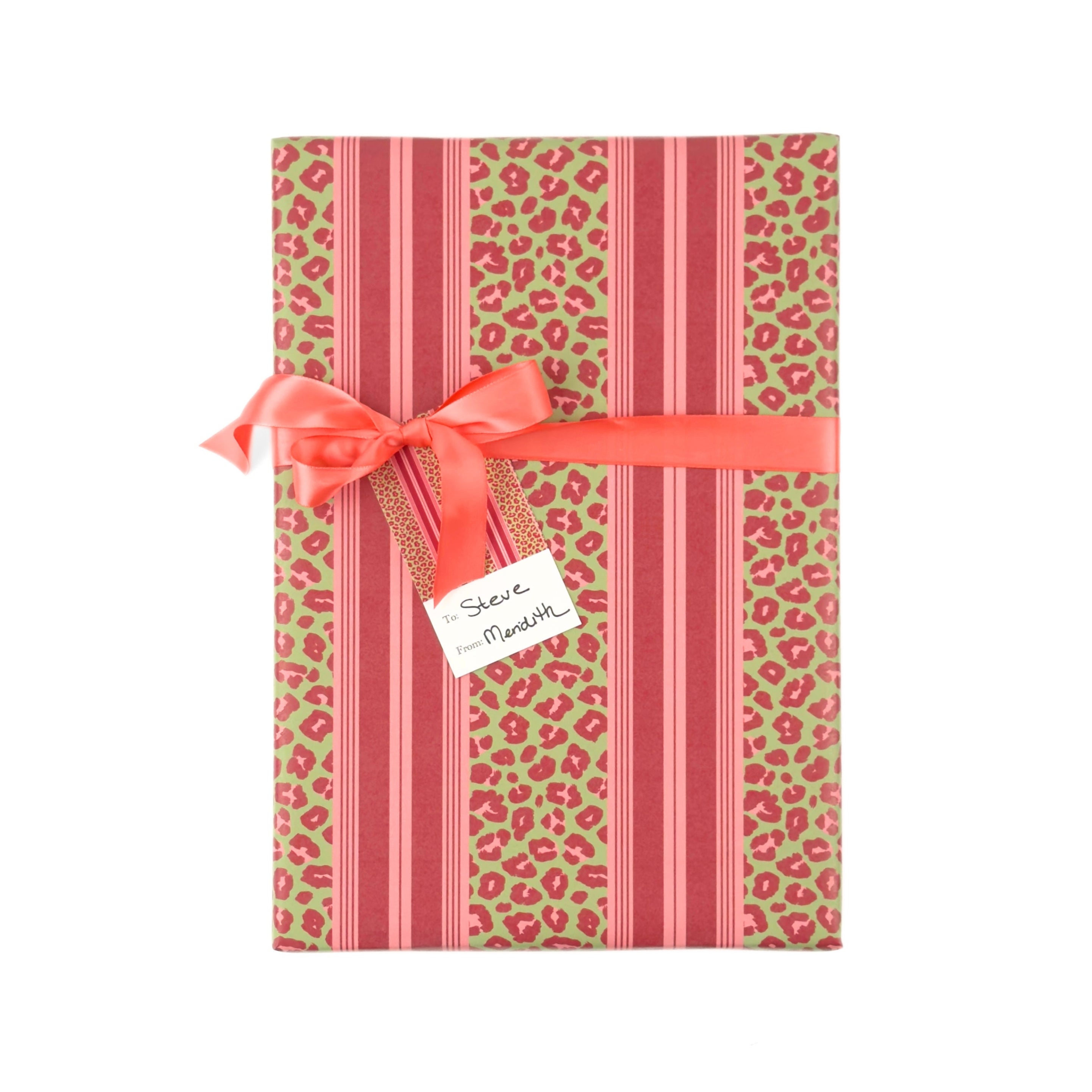 Stylish gift wrap featuring bold pink leopard prints, vibrant green accents, and elegant striped patterns.