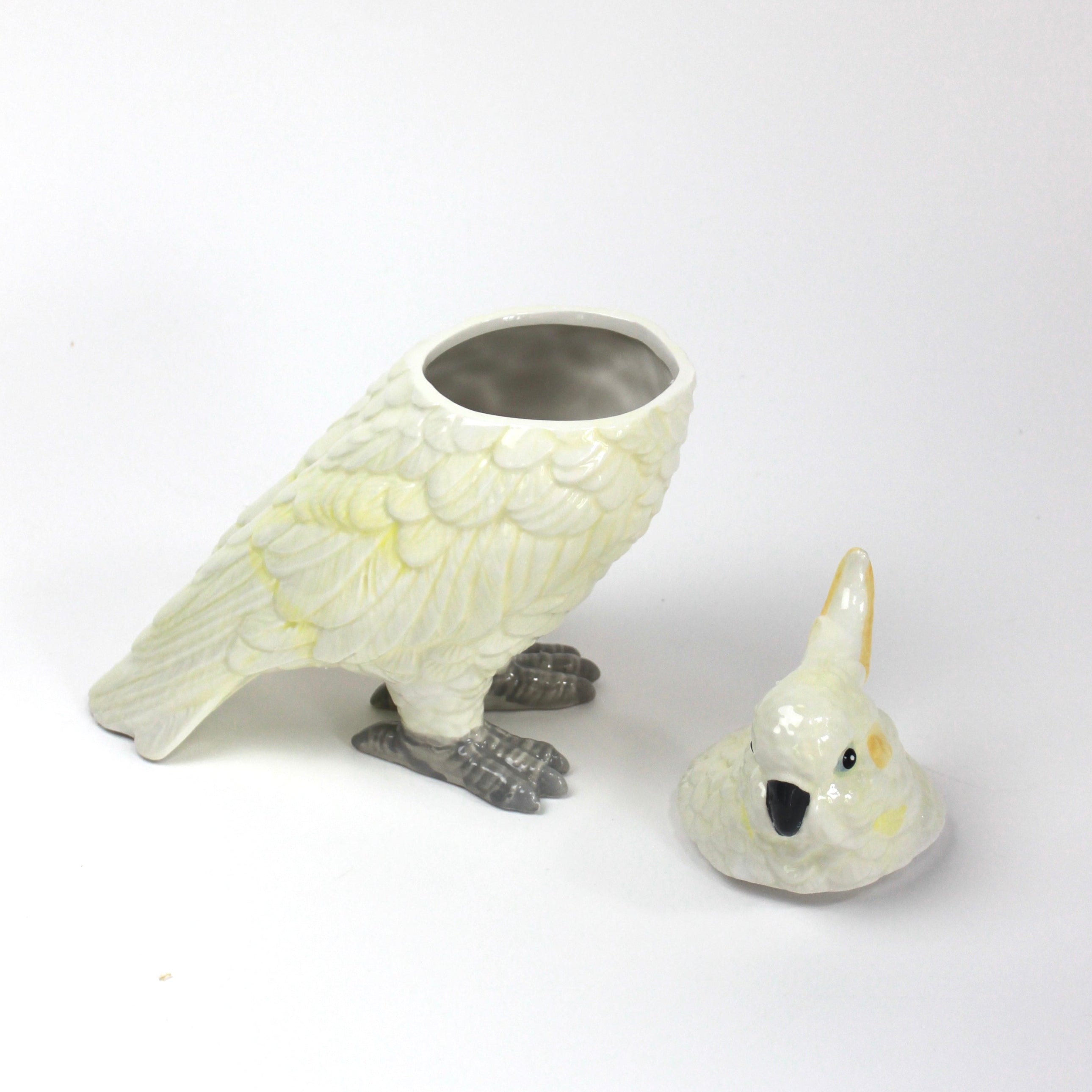 A white ceramic cockatoo from madcap cottage with the lid removed