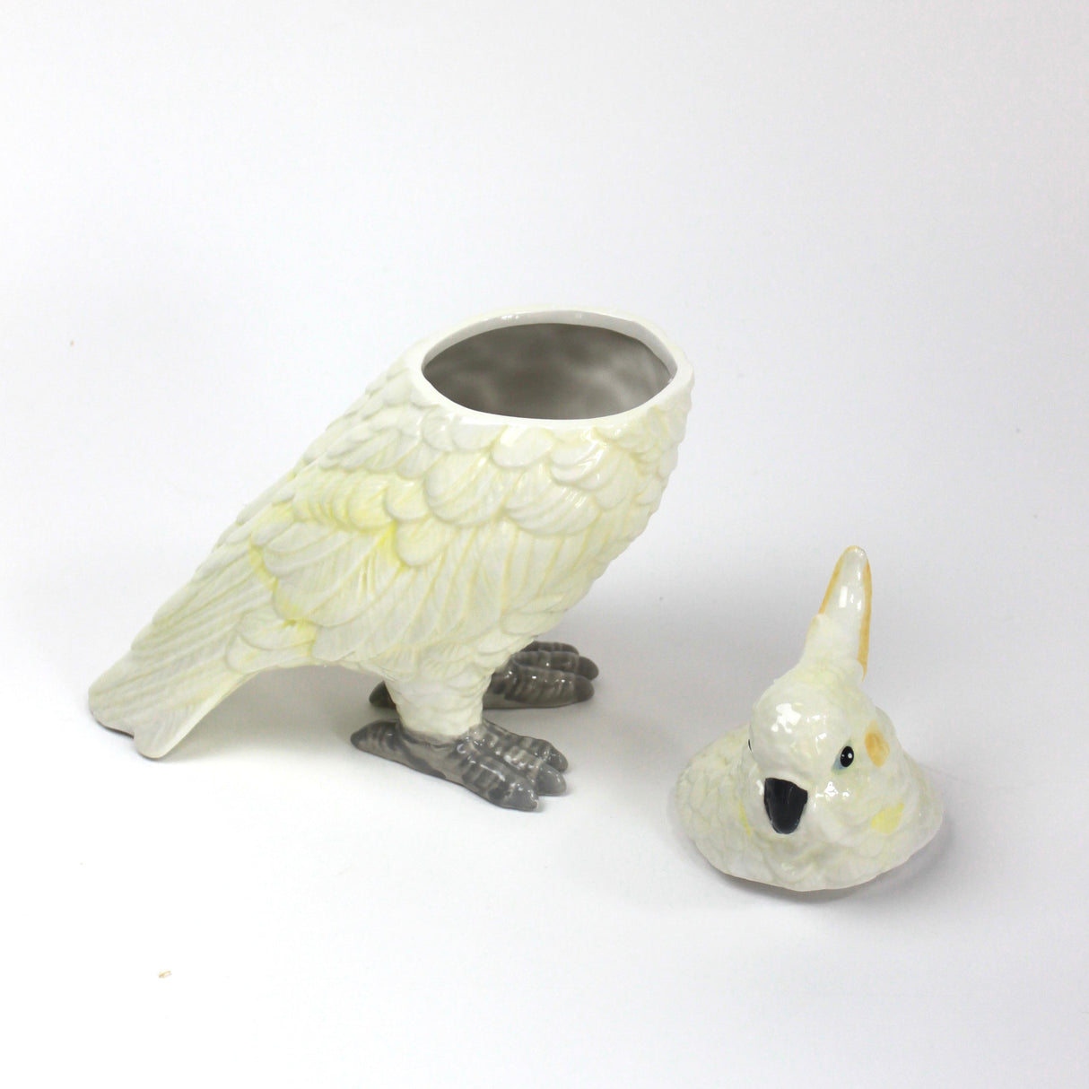 A white ceramic cockatoo from madcap cottage with the lid removed