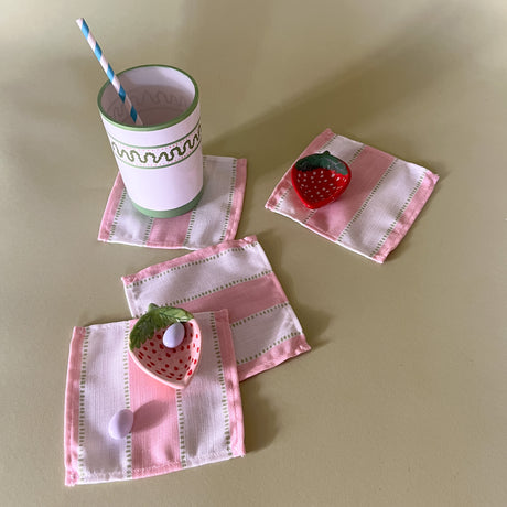 cabana boy pink and white stripe cloth cocktail napkins with strawberry accent dishes and cup