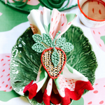 gathered strawberry cloth dinner  napkin with a strawberry napkin ring on a cabbage plate