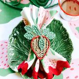 gathered strawberry cloth dinner  napkin with a strawberry napkin ring on a cabbage plate