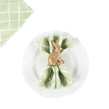 Gold bunny napkin ring holding a green lattice napkin on a white plate, charming holiday table accent perfect for Christmas tea towel styling, seasonal entertaining, and festive home décor
