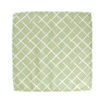 Green lattice pattern tea towel with white crisscross design on a white background, fresh kitchen linen perfect for Christmas tea towel styling, holiday cooking, and seasonal home décor