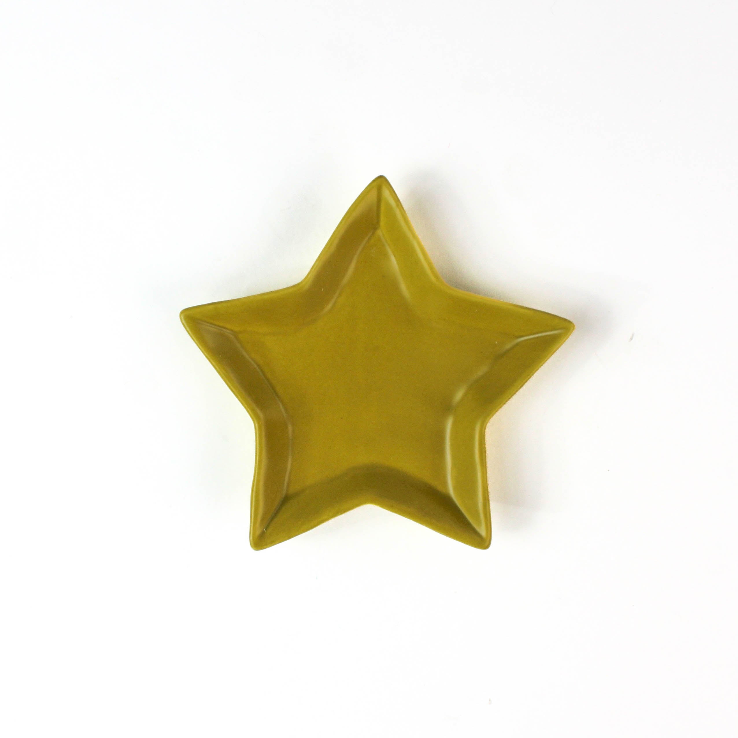 Yellow star-shaped dish on a white background