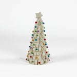 a looped felt white christmas tree table decoration iwith a white star on top and coloured felt ornaments dotted around the trees against a white background. 