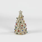 a looped felt white christmas tree table decoration iwith a white star on top and coloured felt ornaments dotted around the trees against a white background. 