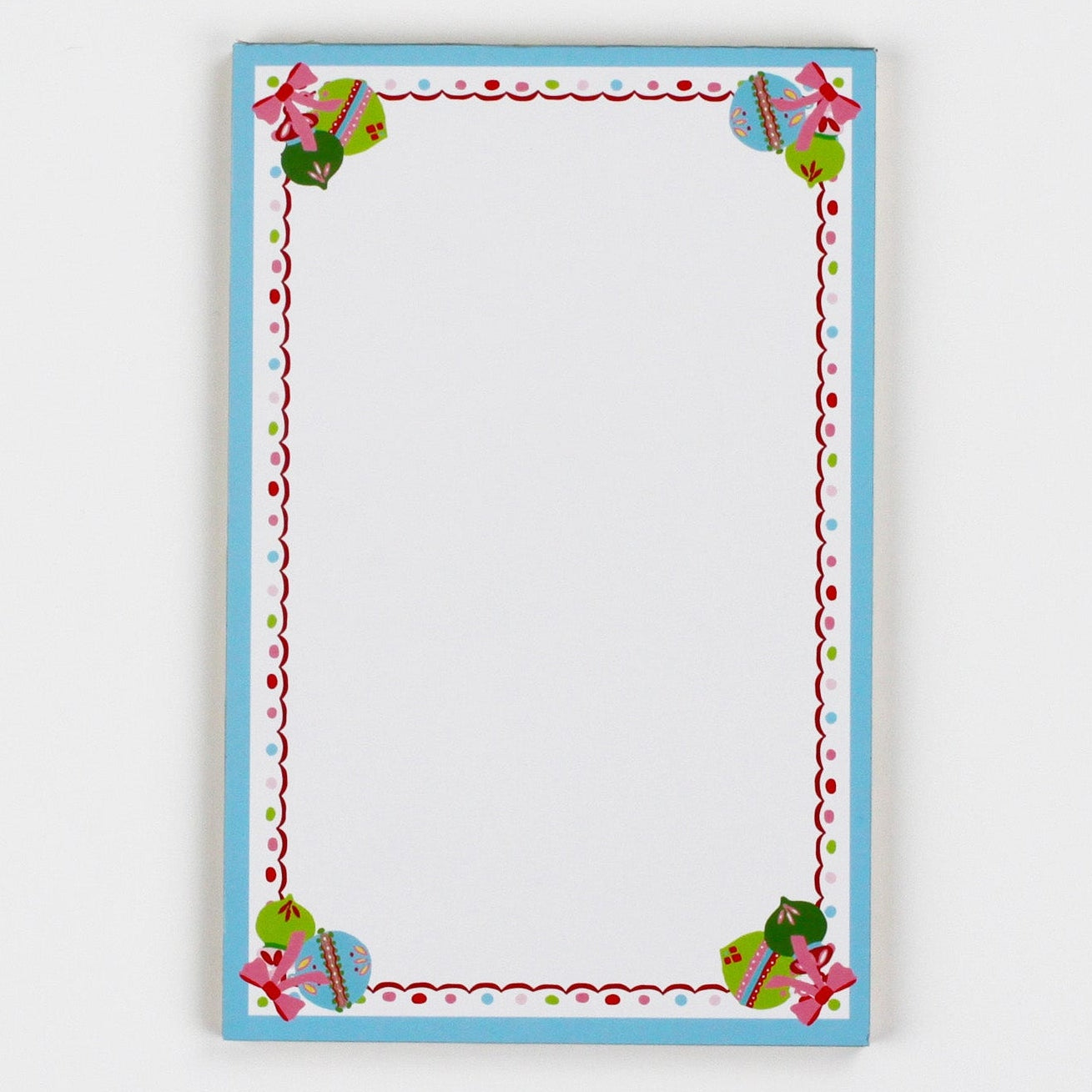 luxury christmas notepads with ornament and holly motifs against a white background.