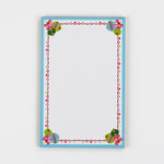luxury christmas notepads with ornament and holly motifs against a white background.