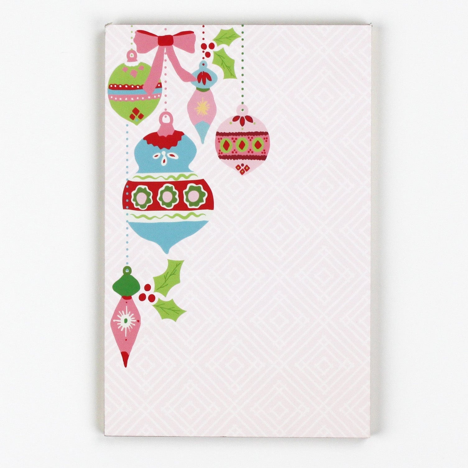 luxury christmas notepads with ornament and holly motifs against a white background.