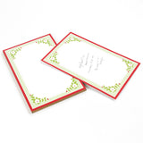 Christmas Flora Luxe notepad with red border and green floral design in white background