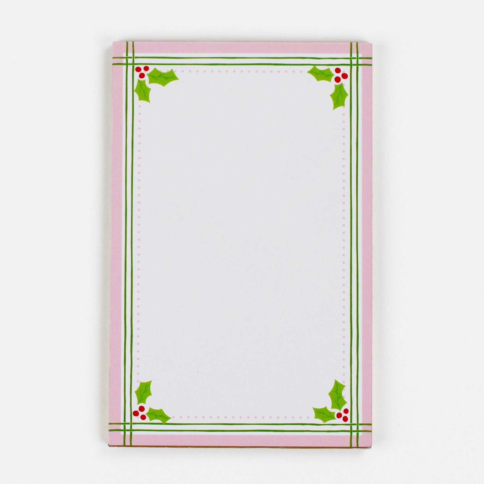 Christmas Holly notepad with pink border and green holly leaf design in a white background