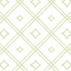 A green bamboo trellis wallpaper design on a white background from Madcap Cottage. 