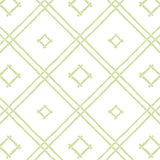 A green bamboo trellis wallpaper design on a white background from Madcap Cottage. 