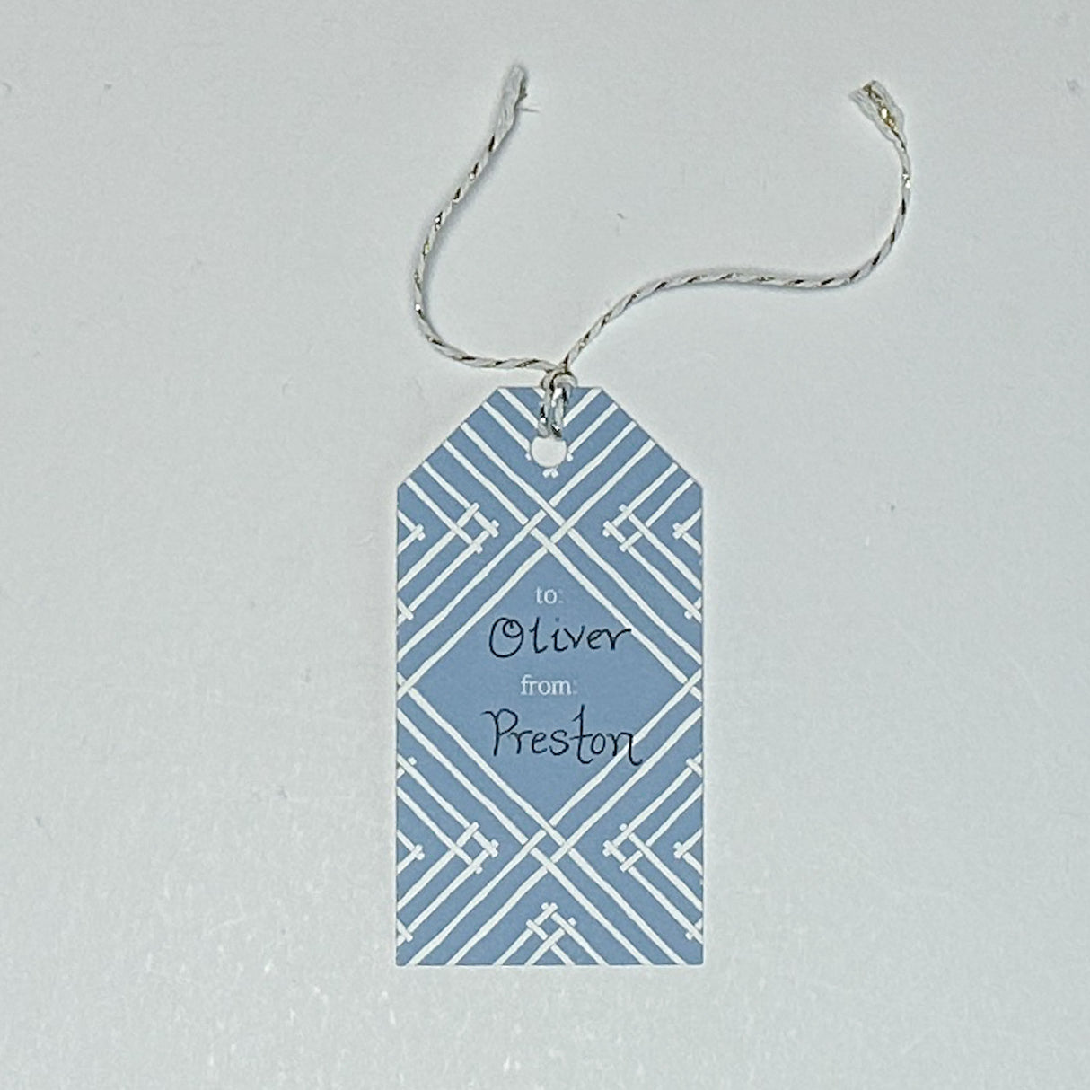 gift tag with a geometric lattice pattern in blue, with a space for personalized message.