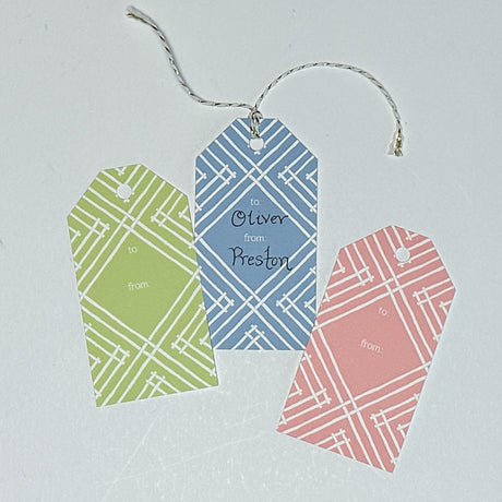 Three gift tags with a geometric lattice pattern in blue, pink and yellow, with a space for personalized message.