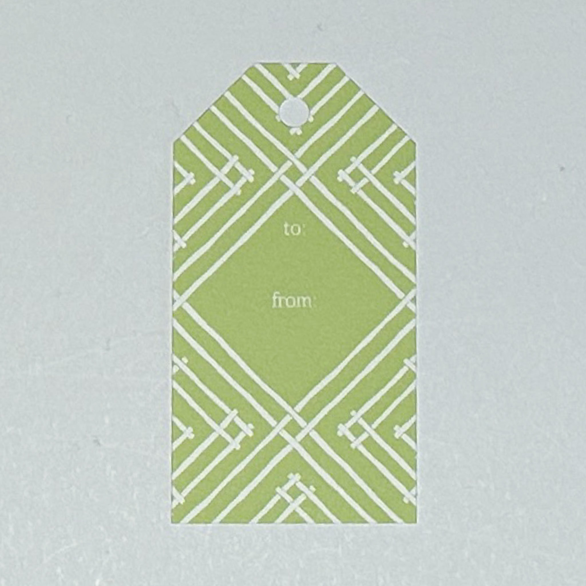 a gift tag with a geometric lattice pattern in green/yellow, with a space for personalized message.