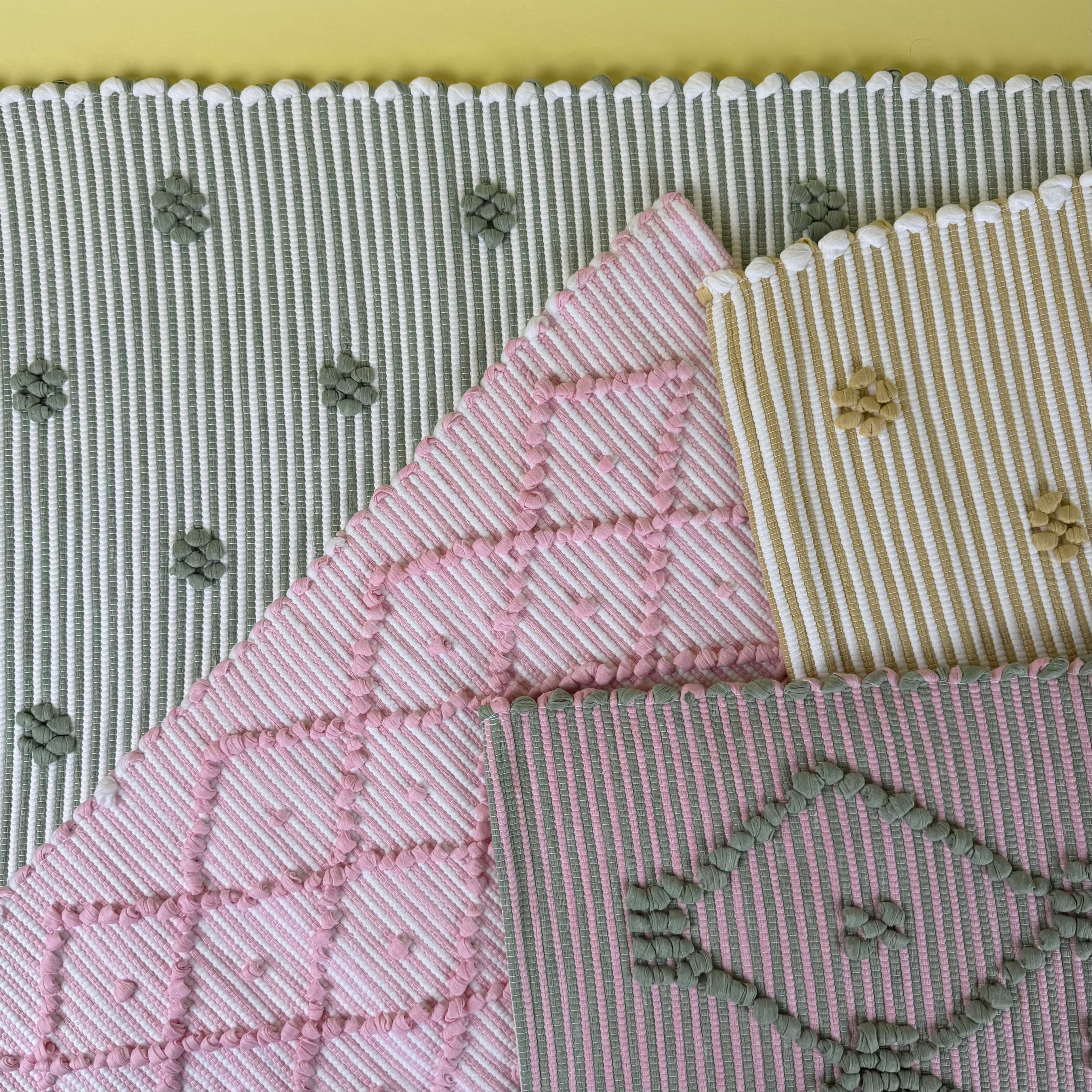 spring accent rugs with colorful textured patterns.