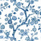 Blue and white chinoiserie wallpaper featuring blue cherry blossom motifs on a white background.