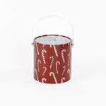 Dancing Candy Canes is a red acrylic Christmas ice bucket covered in a candy can motif fabric