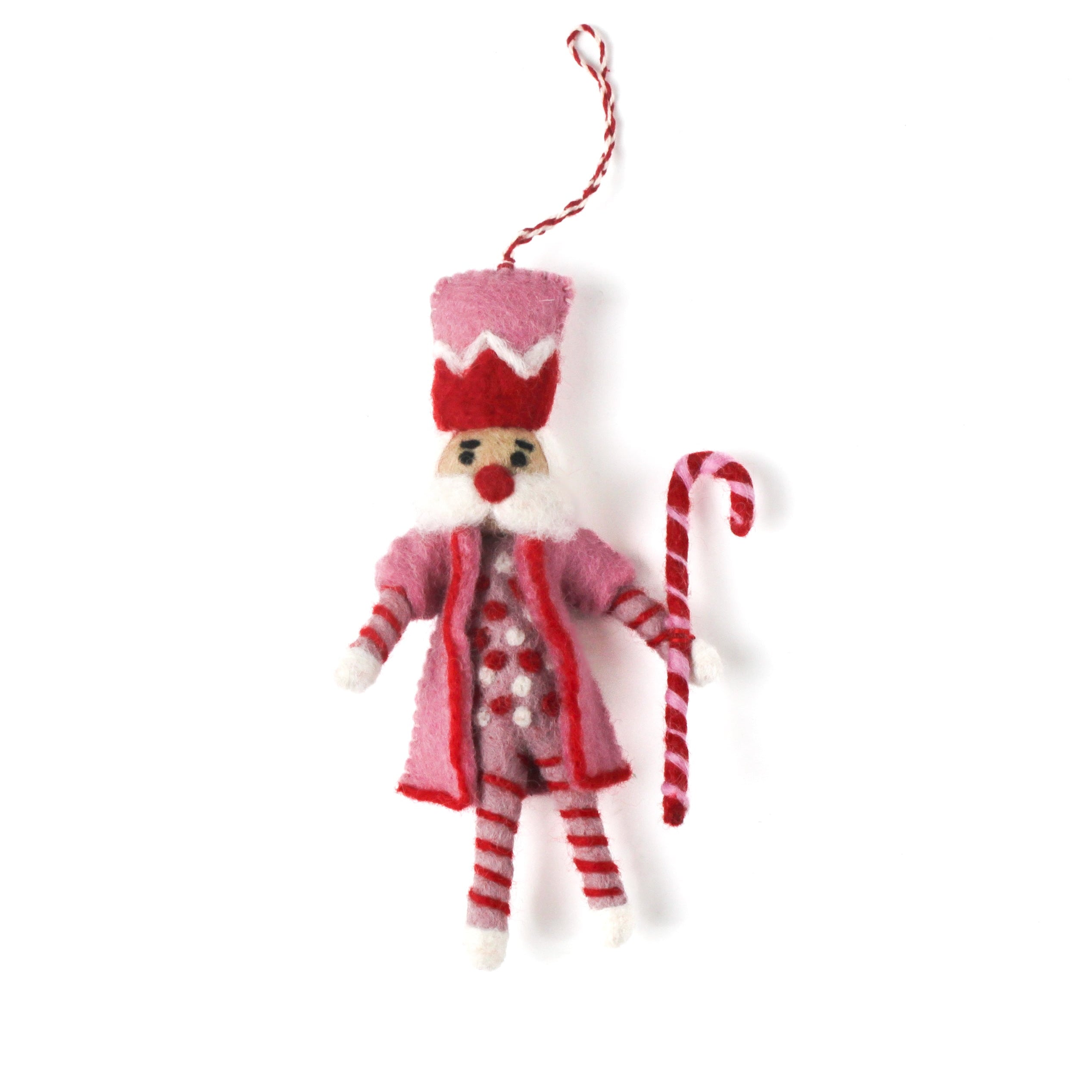 a madcap cottage Christmas felt nutcracker ornament in red and white striped outfit on a white background